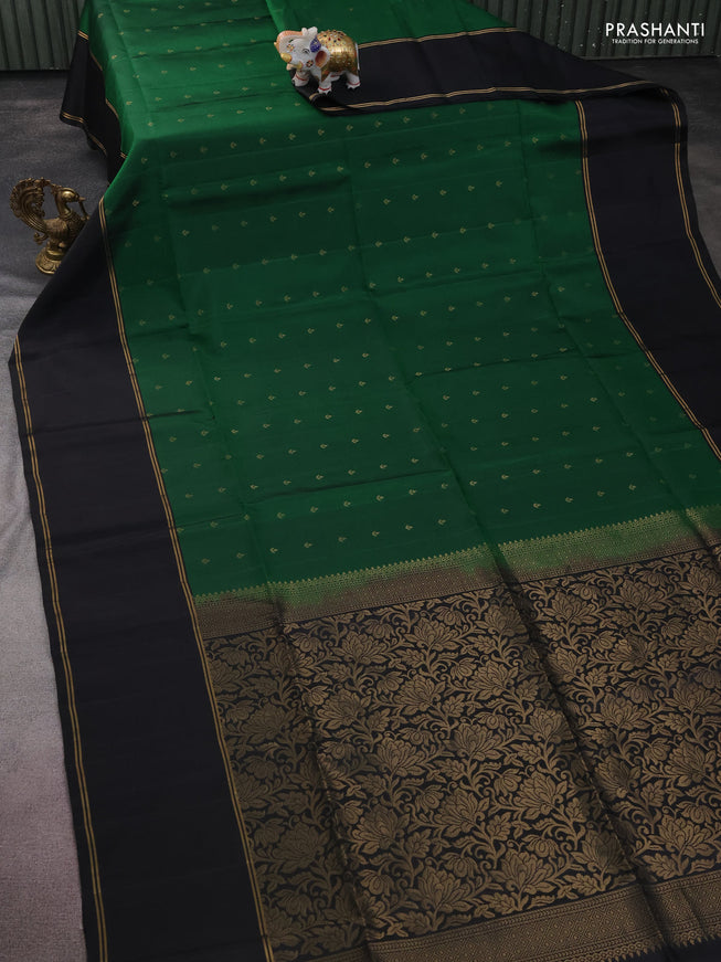 Pure soft silk saree green and black with allover zari woven buttas and rettapet zari woven border