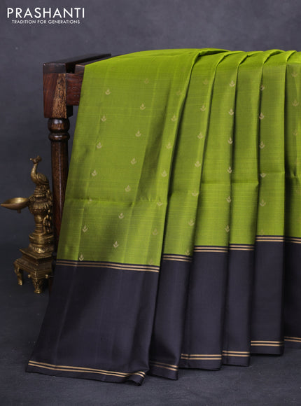Pure soft silk saree light green and black with allover zari woven buttas and rettapet zari woven border