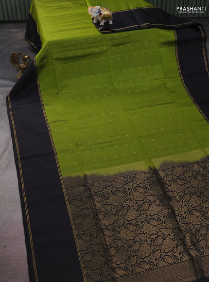 Pure soft silk saree light green and black with allover zari woven buttas and rettapet zari woven border