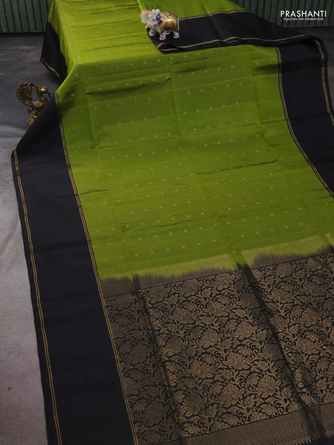 Pure soft silk saree light green and black with allover zari woven buttas and rettapet zari woven border