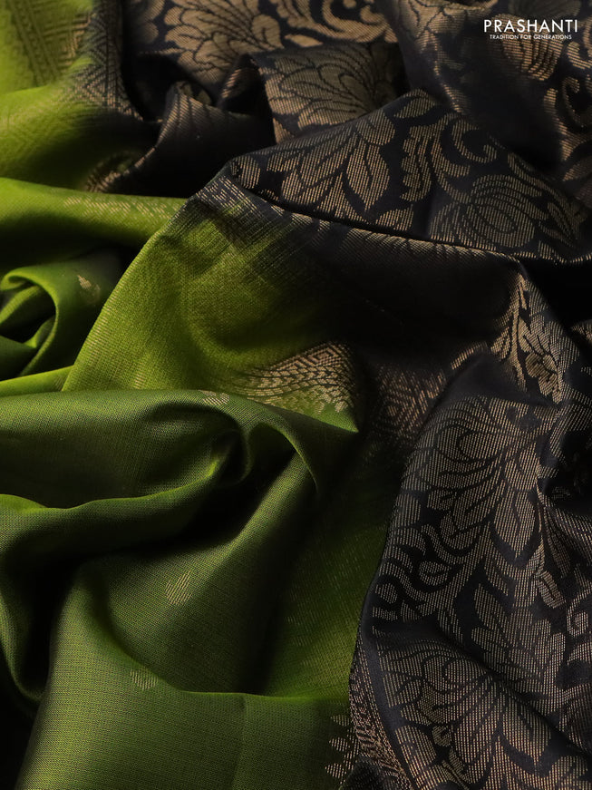 Pure soft silk saree light green and black with allover zari woven buttas and rettapet zari woven border