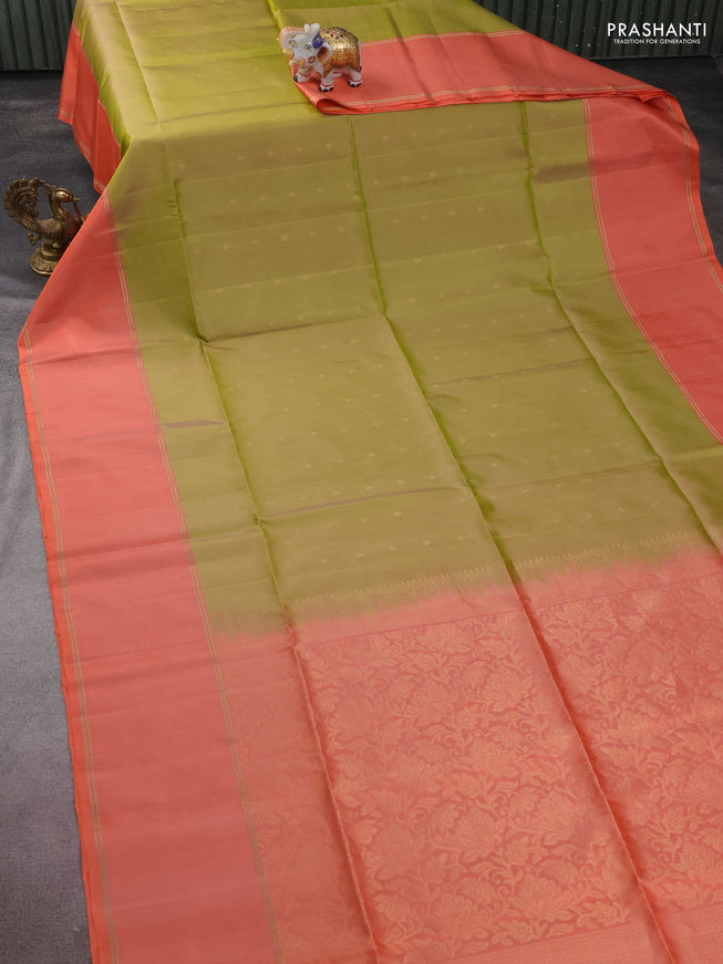 Pure soft silk saree dual shade of green and peach orange with allover zari woven buttas and rettapet zari woven border