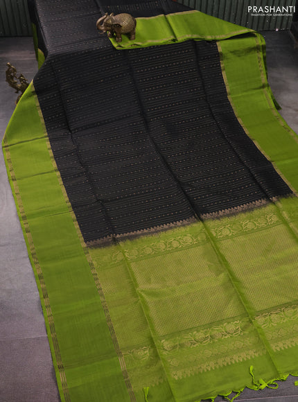 Pure soft silk saree black and light green with allover zari weaves and rettapet zari woven border