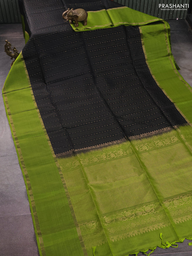 Pure soft silk saree black and light green with allover zari weaves and rettapet zari woven border