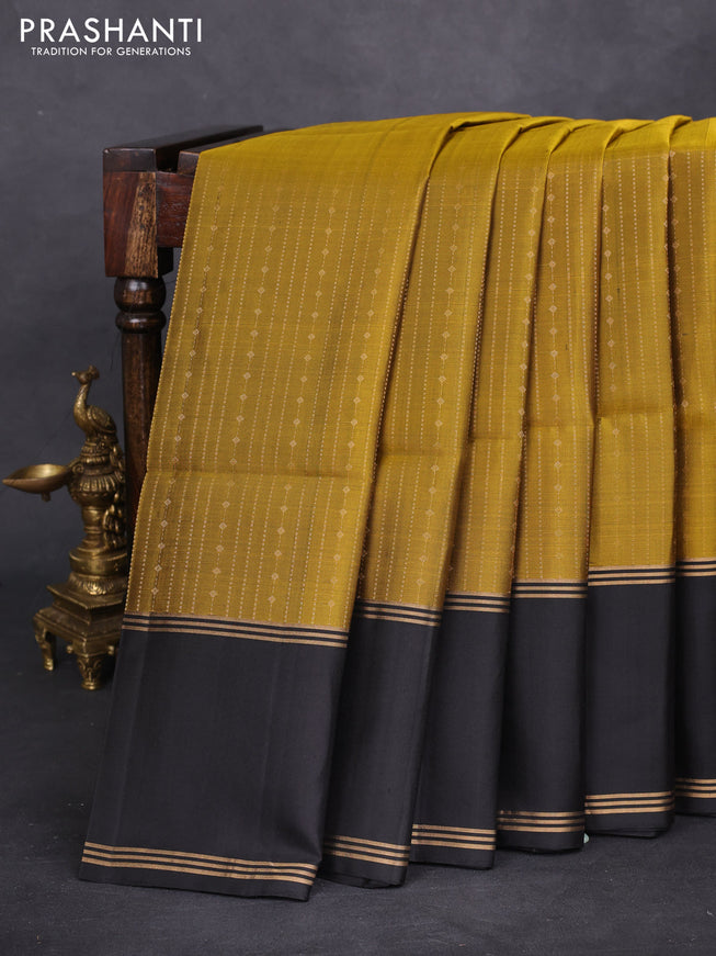 Pure soft silk saree mehendi green and black with allover zari weaves and rettapet zari woven border