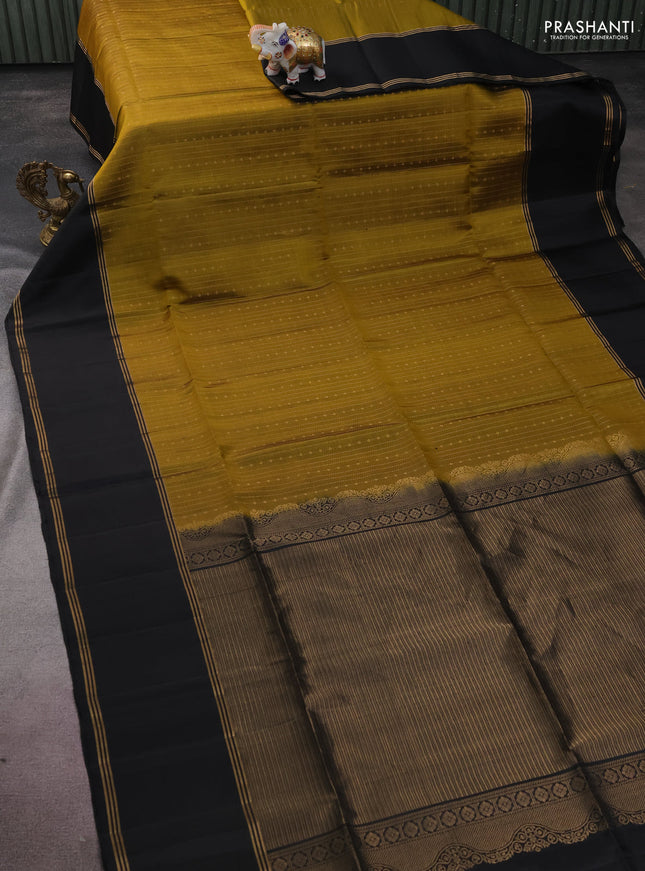 Pure soft silk saree mehendi green and black with allover zari weaves and rettapet zari woven border