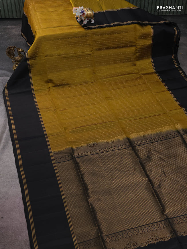 Pure soft silk saree mehendi green and black with allover zari weaves and rettapet zari woven border