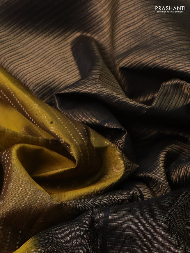 Pure soft silk saree mehendi green and black with allover zari weaves and rettapet zari woven border