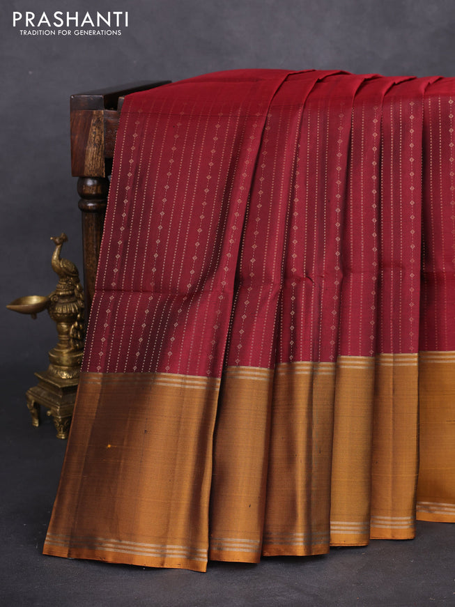 Pure soft silk saree maroon and dark mustard with allover zari weaves and rettapet zari woven border