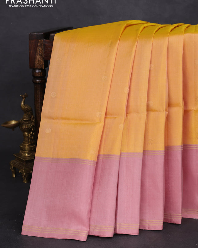 Pure soft silk saree yellow and pastel peach with zari woven floral buttas and rettapet zari woven border