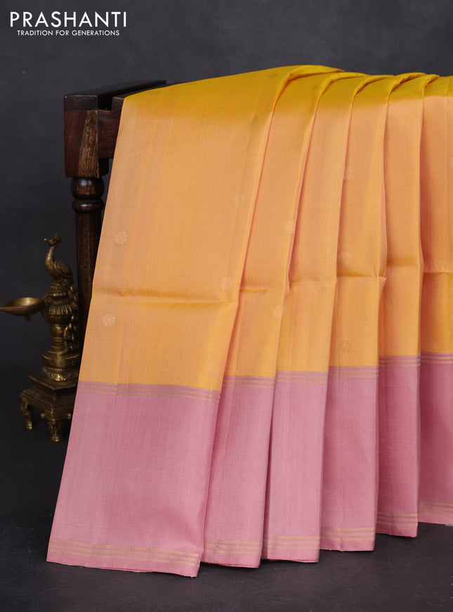 Pure soft silk saree yellow and pastel peach with zari woven floral buttas and rettapet zari woven border