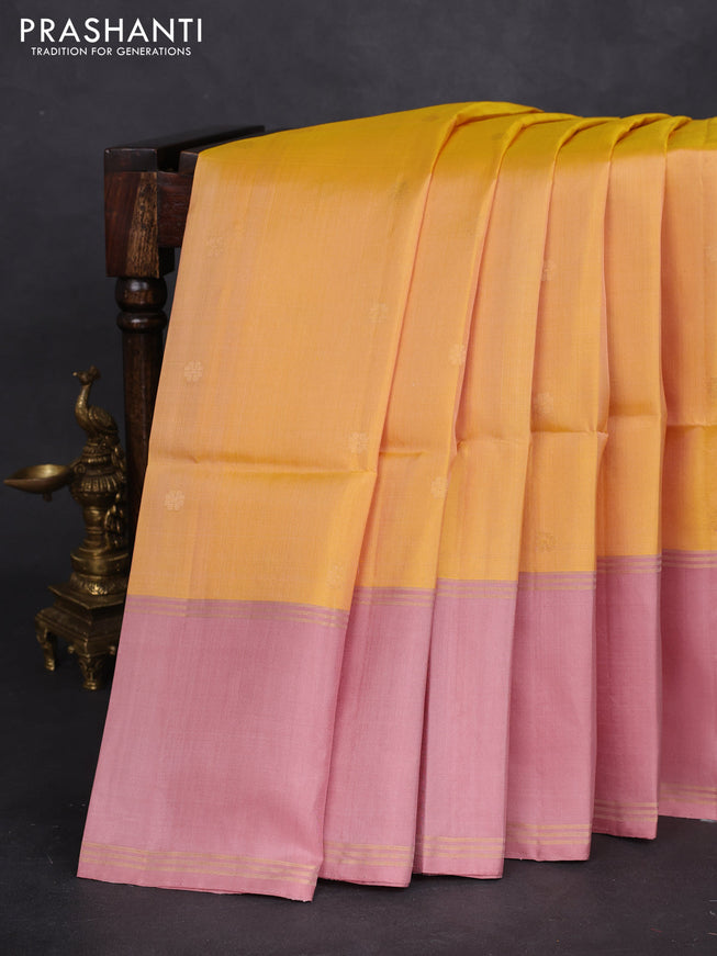 Pure soft silk saree yellow and pastel peach with zari woven floral buttas and rettapet zari woven border