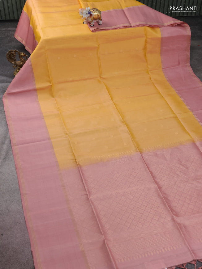 Pure soft silk saree yellow and pastel peach with zari woven floral buttas and rettapet zari woven border