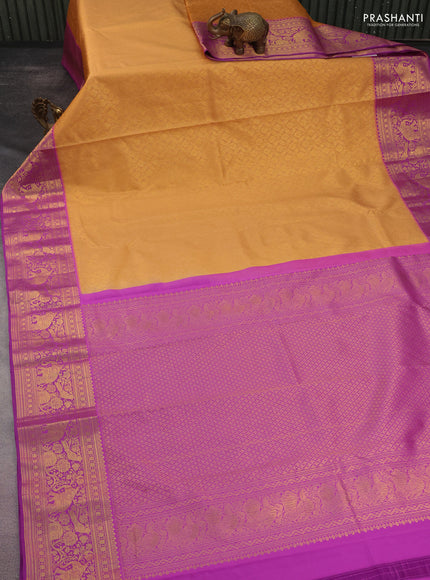 Kanchipuram silk saree peach orange and purple with allover zari woven brocade weaves and rich zari woven border