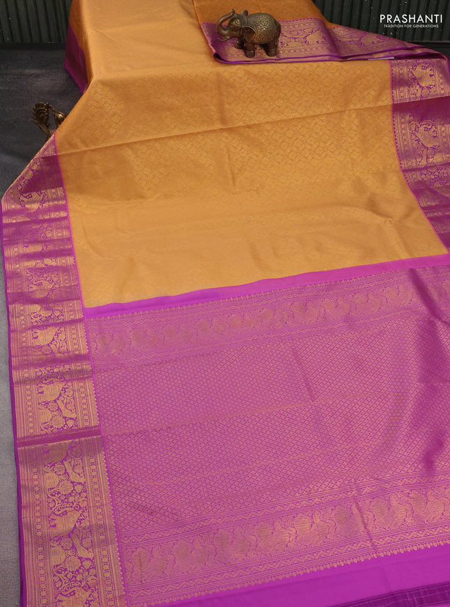 Kanchipuram silk saree peach orange and purple with allover zari woven brocade weaves and rich zari woven border
