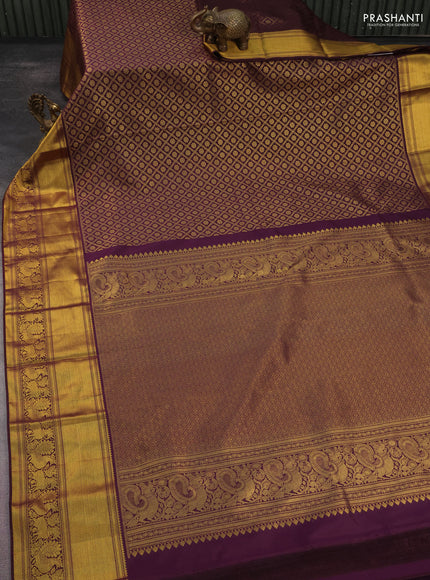 Kanchipuram silk saree wine shade with allover zari woven brocade weaves and long rich zari woven border