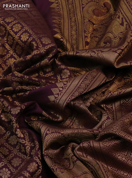 Kanchipuram silk saree wine shade with allover zari woven brocade weaves and long rich zari woven border