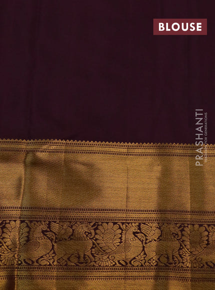 Kanchipuram silk saree wine shade with allover zari woven brocade weaves and long rich zari woven border