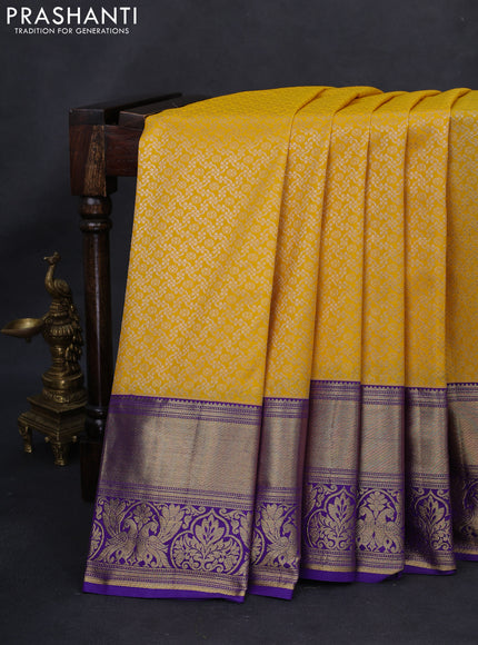Kanchipuram silk saree yellow and violet with allover silver zari woven brocade weaves and long rich zari woven border