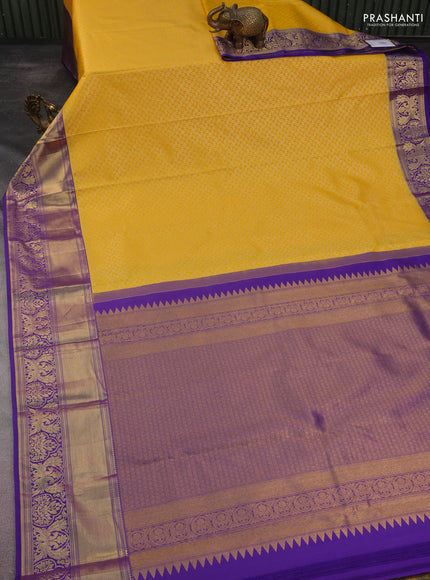 Kanchipuram silk saree yellow and violet with allover silver zari woven brocade weaves and long rich zari woven border