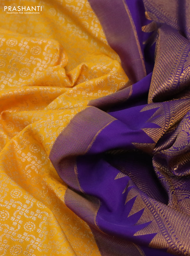Kanchipuram silk saree yellow and violet with allover silver zari woven brocade weaves and long rich zari woven border