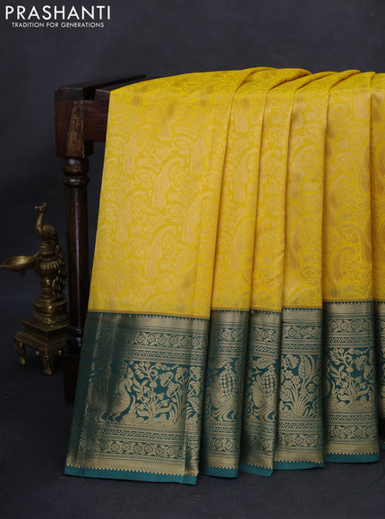 Kanchipuram silk saree yellow and green shade with allover zari woven brocade weaves and long rich zari woven border