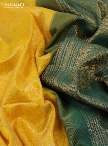 Kanchipuram silk saree yellow and green shade with allover zari woven brocade weaves and long rich zari woven border