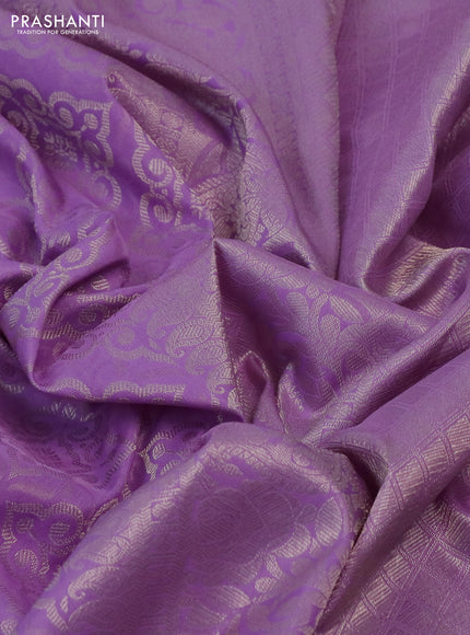 Kanchipuram silk saree lavender with allover silver zari woven brocade weaves and long rich silver zari woven border