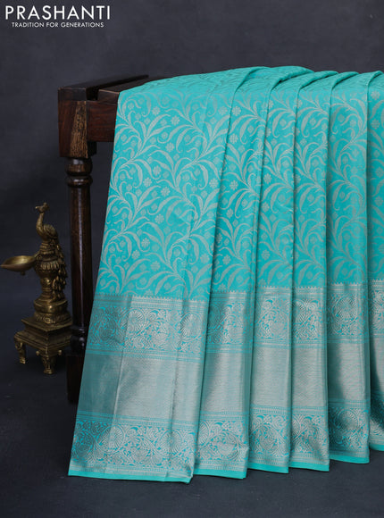 Kanchipuram silk saree teal green with allover silver zari woven brocade weaves and long rich silver zari woven border
