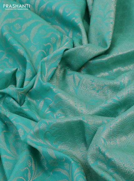 Kanchipuram silk saree teal green with allover silver zari woven brocade weaves and long rich silver zari woven border