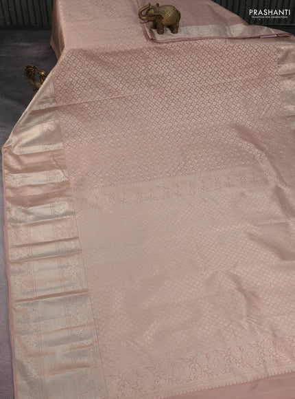 Kanchipuram silk saree pastel pink with allover silver zari woven brocade weaves and long rich silver zari woven border