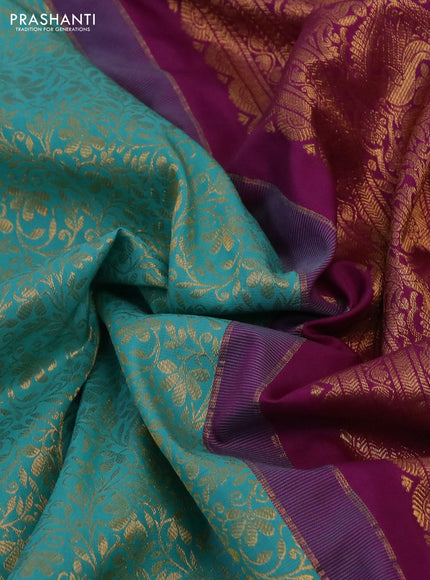 Kanchipuram silk saree teal blue and purple with allover zari woven brocade weaves and long rich zari woven border