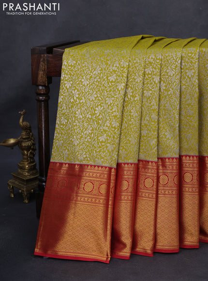 Kanchipuram silk saree mustard green and red with allover silver zari woven brocade weaves and long rich zari woven border