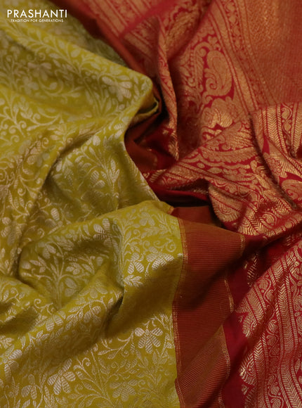 Kanchipuram silk saree mustard green and red with allover silver zari woven brocade weaves and long rich zari woven border
