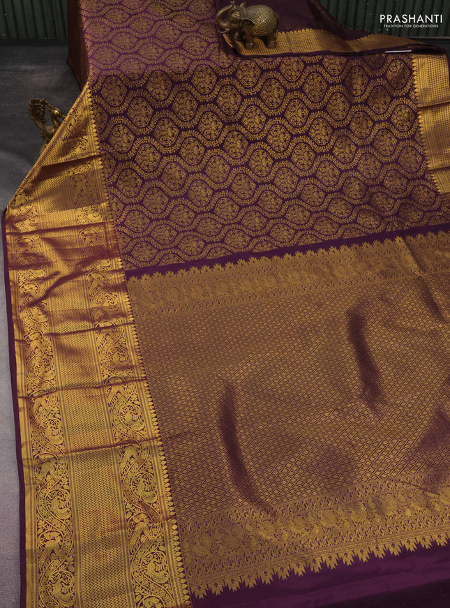 Kanchipuram silk saree wine shade with allover zari woven brocade weaves and long rich zari woven border
