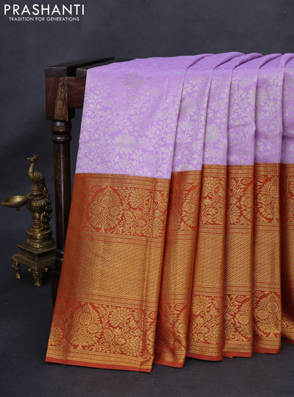 Kanchipuram silk saree lavender and rustic orange with allover zari woven brocade weaves and long rich zari woven border