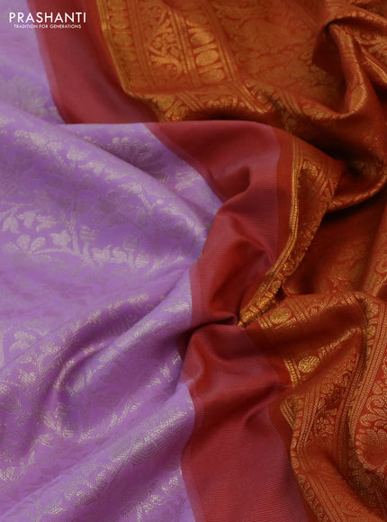 Kanchipuram silk saree lavender and rustic orange with allover zari woven brocade weaves and long rich zari woven border