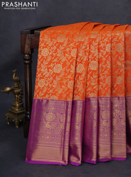 Kanchipuram silk saree orange and purple with allover zari woven floral brocade weaves and long rich zari woven border