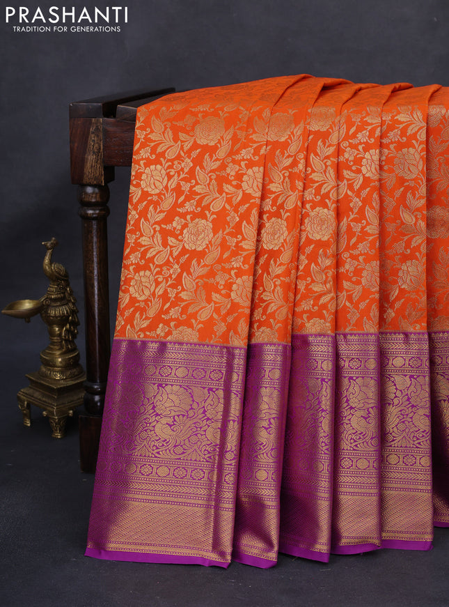 Kanchipuram silk saree orange and purple with allover zari woven floral brocade weaves and long rich zari woven border