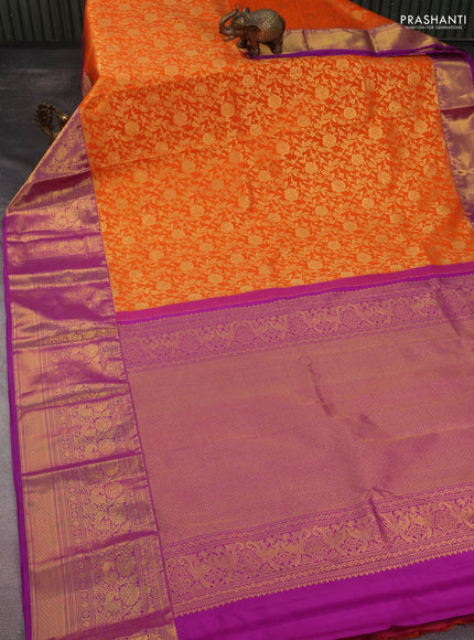 Kanchipuram silk saree orange and purple with allover zari woven floral brocade weaves and long rich zari woven border