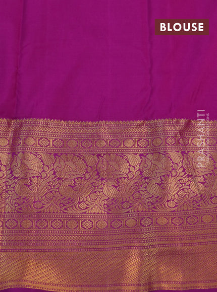 Kanchipuram silk saree orange and purple with allover zari woven floral brocade weaves and long rich zari woven border