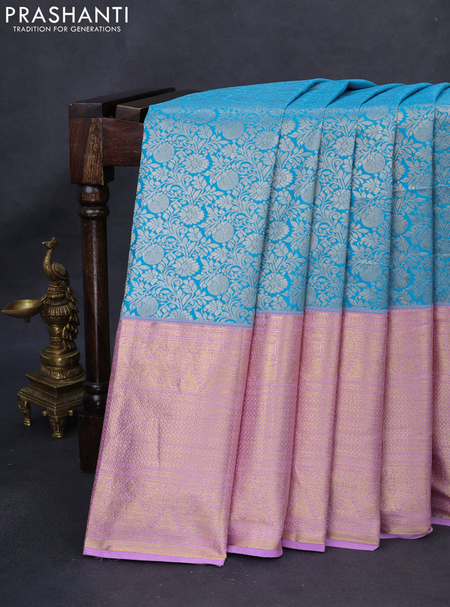 Kanchipuram tissue silk saree teal blue and lavender with allover silver zari woven brocade weaves and long rich zari woven border