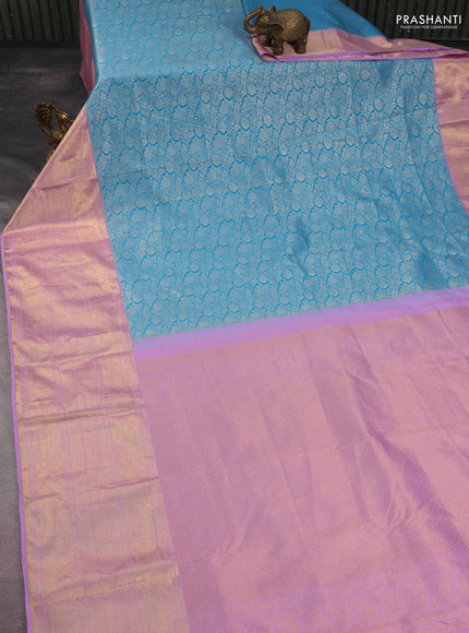 Kanchipuram tissue silk saree teal blue and lavender with allover silver zari woven brocade weaves and long rich zari woven border