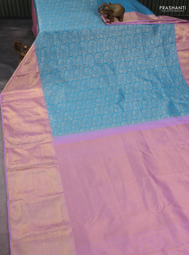 Kanchipuram tissue silk saree teal blue and lavender with allover silver zari woven brocade weaves and long rich zari woven border