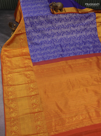 Kanchipuram silk saree blue and rustic orange with allover silver zari woven brocade weaves and long rich zari woven border