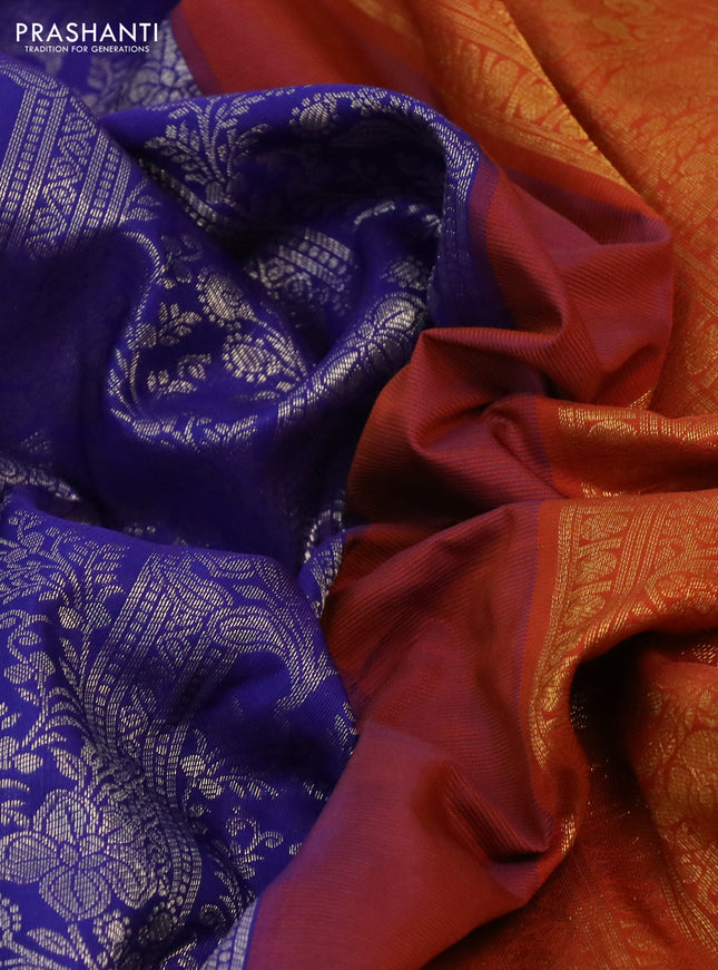 Kanchipuram silk saree blue and rustic orange with allover silver zari woven brocade weaves and long rich zari woven border