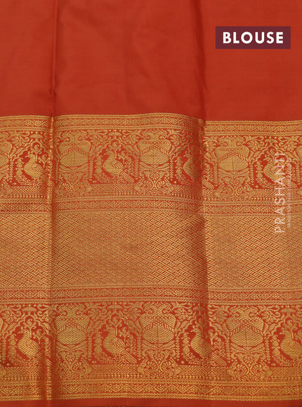 Kanchipuram silk saree blue and rustic orange with allover silver zari woven brocade weaves and long rich zari woven border