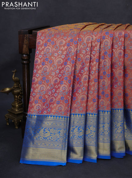 Kanchipuram tissue silk saree peach pink shade and cs blue with allover zari woven brocade weaves and long rich zari woven border