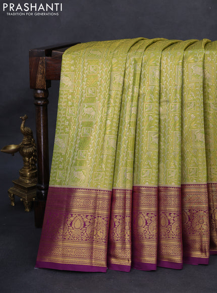 Kanchipuram tissue silk saree light green and purple with allover zari woven brocade weaves and rich zari woven border