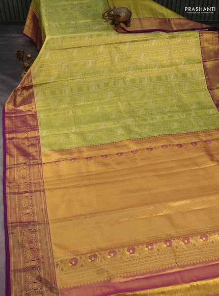 Kanchipuram tissue silk saree light green and purple with allover zari woven brocade weaves and rich zari woven border